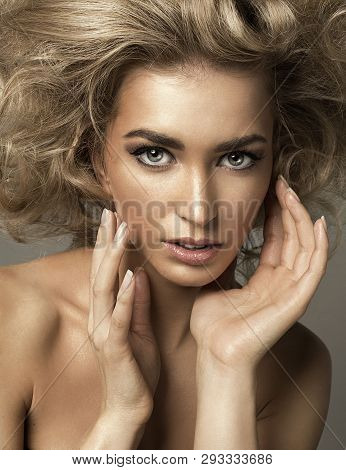 Portrait Of Blond Woman With Beautiful Eyes