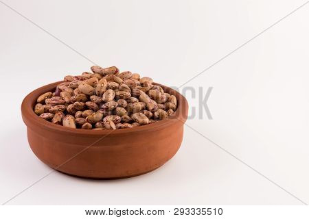 A Plate Of Beans On White Background