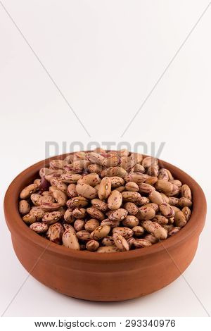 A Plate Of Beans On White Background