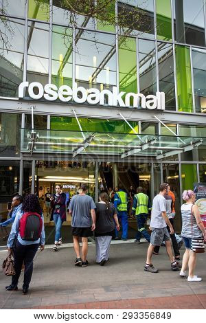 Johannesburg, South Africa, 22nd March- 2019: Entrance To Modern Mall With Pedestrians Walking.