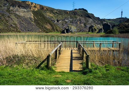 Wooden Footbridge Next To A Lake, La Arboleda, Basque Country
