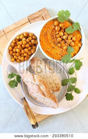 Vegetarian Appetizer. Carrot And Hummus Dip And Bread, Sesame And Chick-pea Dressing On Light Backgr