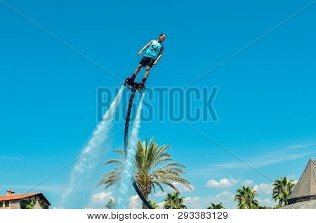 Belek, Turkey - September 12, 2018. Exciting Fly Board Watershow On A Sunny Summer Day. A Man Is Doi