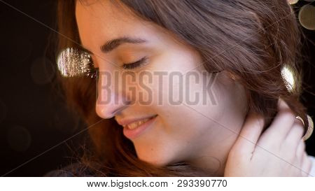 Closeup Shoot Of Young Attractive Caucasian Female Smiling Seductively Looking At The Side Iwith Bok