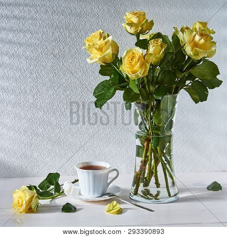 Bouquet Of Roses And A Cup Of Tea In The Morning Light
