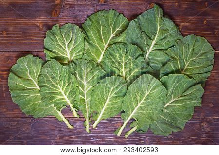 Rastan ( Collard Greens, Collards ) - Popular Leafy Vegetables In Balkan Cuisine. Dark Rustic Backgr