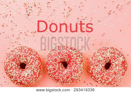 Three Coral Donuts. Donuts With Icing On Pink Background.