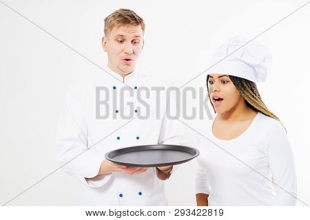 Chefs Team Is Looking At Something On An Empty Tray