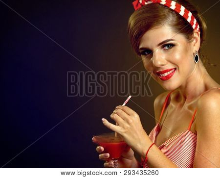 Pin up girl drink red long martini cocktails and flirtation on redux style themed night party.