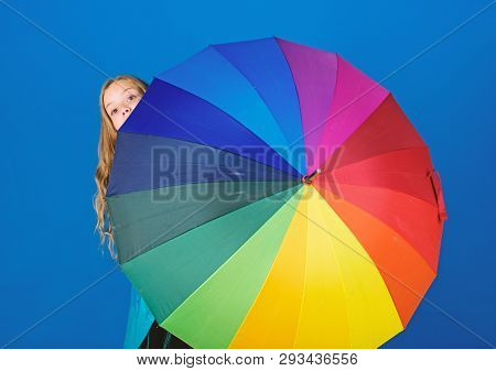 Girl Cheerful Hide Behind Umbrella. Colorful Umbrella Accessory. Weather Forecast Concept. Stay Posi