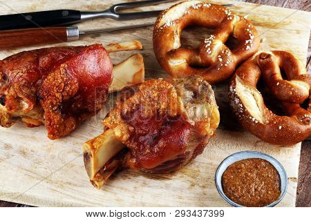 Traditional German Cuisine, Schweinshaxe Roasted Ham Hock And Pretzels