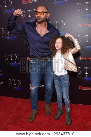 LAS VEGAS - APR 02:  Dave Bautista and Chloe Coleman arrives for the CinemaCon 2019 - STXfilms presentation 