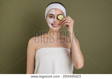 Young European Girl With White Cosmetic Masak On Her Face