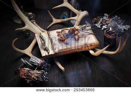 Magic And Divination. A Mysterious Composition Of Dry Flowers And Old Photos.