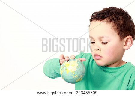 Little Boy With Globe In His Hand With White Background Stock Photo