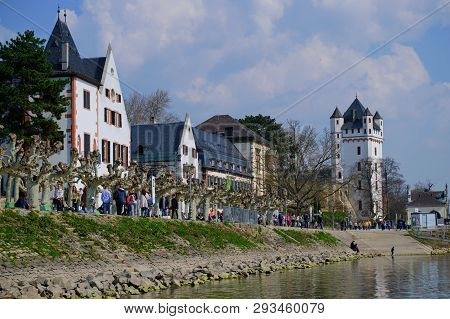 Eltville, Germany - March 31, 2019: River Promenade In Eltville With People On A Sunny Day With View