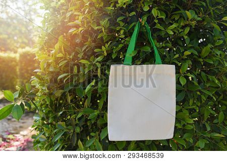 White Tote Canvas Fabric Eco Bag Cloth Shopping Sack On Green Leaf Nature Background / Zero Waste Us