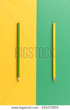 Colored Pencils On Dual Color Paper Background