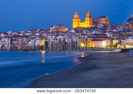 Beautiful View Of The Beach, Cefalu Cathedral And Old Town Of Coastal City Cefalu During Evening Blu