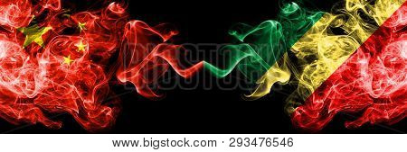 China Vs Congo, Congolese Smoke Flags Placed Side By Side. Thick Colored Silky Smoke Flags Of Chines