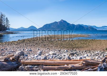 Fantastic view over ocean, snow mountain and rocks at Sechelt inlet in Vancouver, Canada.