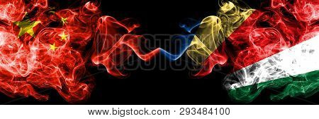 China Vs Seychelles, Seychelloise Smoke Flags Placed Side By Side. Thick Colored Silky Smoke Flags O