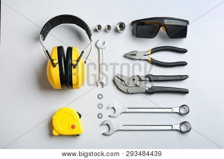 Flat Lay Composition With Different Construction Tools On White Background
