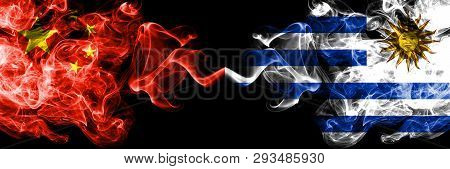 China Vs Uruguay, Uruguayan Smoke Flags Placed Side By Side. Thick Colored Silky Smoke Flags Of Chin