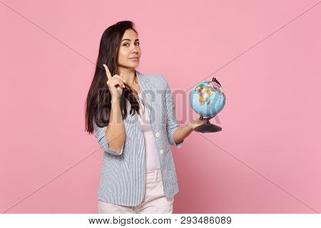 Pensive Young Woman In Striped Jacket Pointing Index Finger Up, Holding Earth World Globe Isolated O