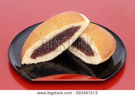 Japanese Confectionery, Dorayaki With Anko Paste On Wooden Plate