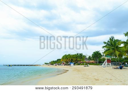 Idyllic Tropical Island Caribbean Summer Vacation. Coconut Palm Trees, Beach Scene.