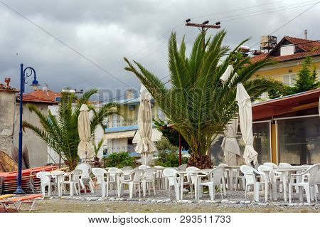 Leptokaria, Pieria, Central Macedonia, Greece - 11th May 2015: Empty outdoor cafe at the beach just prepared for the high season