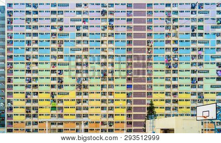 Colorful Rainbow Pastel Building With Basketball Court And Facade Windows Background. Architecture B