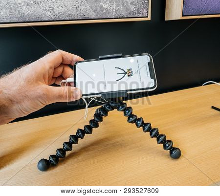 Paris, France - Mar 19 2019: Pov Man Holding Iphone Xs On The Joby Gorillapod Tripod On The Accessor