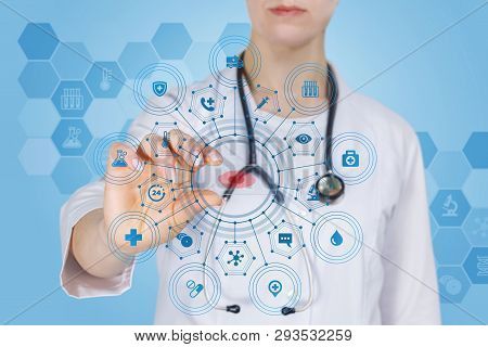 A Closeup Of A Laboratory Assistant Or A Doctor Holding A Glass With Blood Sample In The Middle Of T