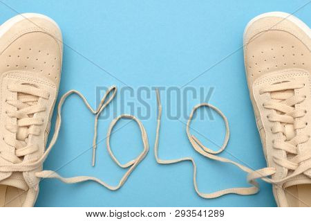 Women Sneakers With Laces In Yolo Abbreviation Text.