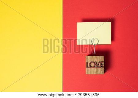 Note Holder Is In The Background. Inscription Love