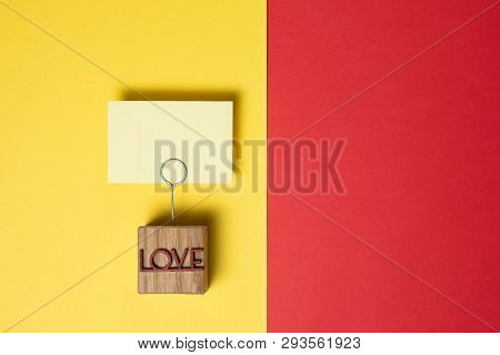 Note Holder Is In The Background. Inscription Love