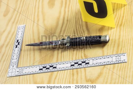 Scene Of Crime, Razor Spotted With Blood, Rule Of Ballistic Measurement, Conceptual Image, Horizonta