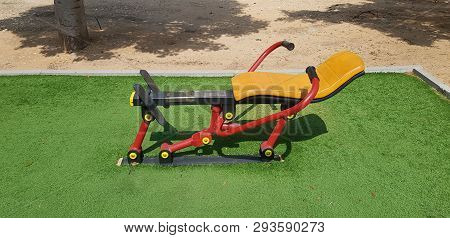 Metal Sports Equipment For Canoe Training On Green Grass In Outdoor Gym At City Park