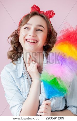 Cleaning Pin Up Woman. Smiling Pinup Girl Holds Colorful Duster Brush. Cleaning Service. Pin-up Girl