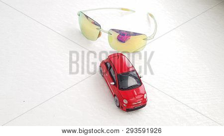 Rishon Lezion, Israel - March 8 2019: Small Red Fiat 500 Toy Rear View Reflected In Green Fashionabl