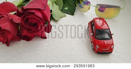 Rishon Lezion, Israel - March 8 2019: Small Red Fiat 500 Toy Reflected In Green Fashionable Sunglass