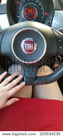 Rishon Lezion, Israel - February 28, 2019: Woman In Red Mini Dress On Drivers Seat In Fiat 500 Sport