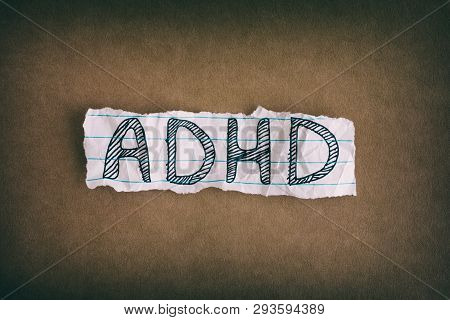 Adhd. Abbreviation Adhd On Brown Background. Close Up. Adhd Is Attention Deficit Hyperactivity Disor