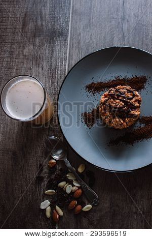 Anthill Cake With Chocolate And Coffee On A Dark Background. Dessert With Nuts And Raisins. Bolo For