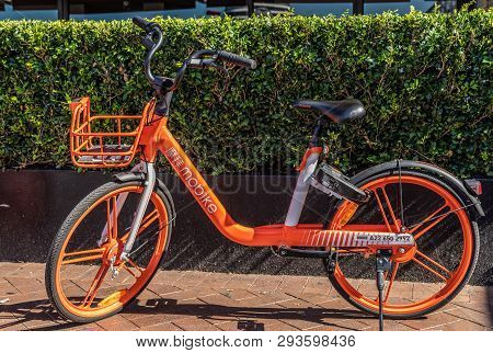 Sydney, Australia - February 11, 2019: Closeup Of Parked Orange Mobike Bicycle For Rent As Seen In F
