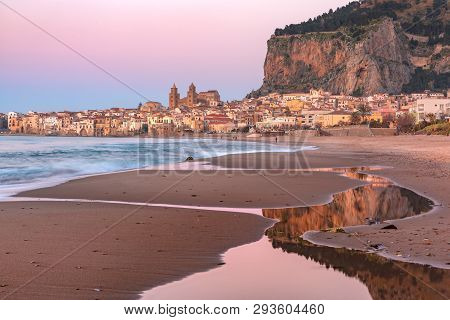 Beautiful Panoramic View Of The Beach, Cefalu Cathedral And Old Town Of Coastal City Cefalu At Sunse