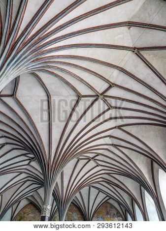 MALBORK, POLAND - 15 AUGUST, 2013: Gothic cloister canopy of Teutonic Malbork castle, Poland. Malbork castle is the largest brick fortress in the world