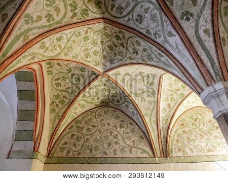 MALBORK, POLAND - 15 AUGUST, 2013: Gothic cloister canopy of Teutonic Malbork castle, Poland. Malbork castle is the largest brick fortress in the world